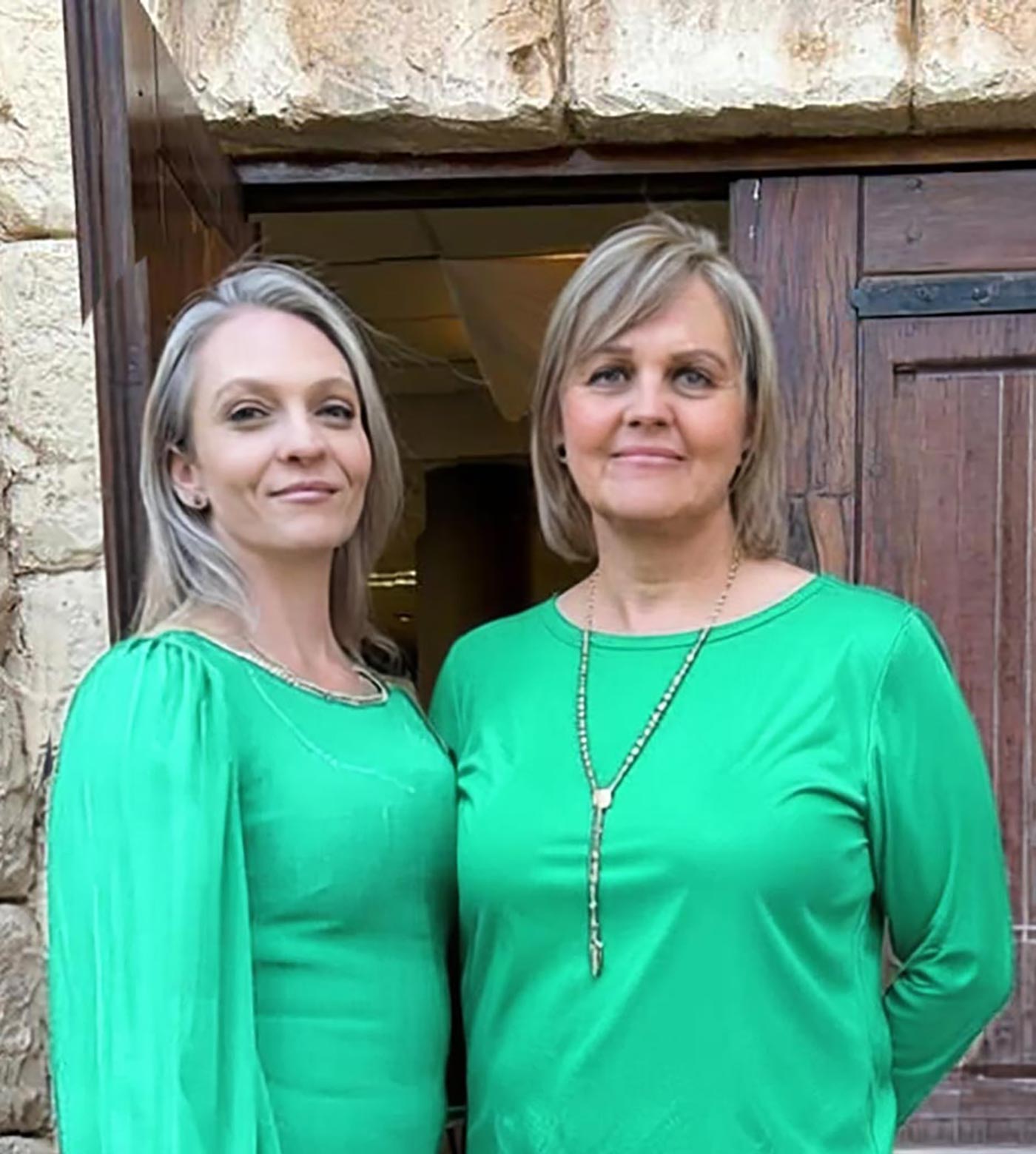 Mel and Jessie from the Home Angels team at the entrance to the home
